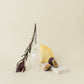 Crystal Red Wine Glasse with metal pin, standing upside-down next to flower and board with figs and cheese