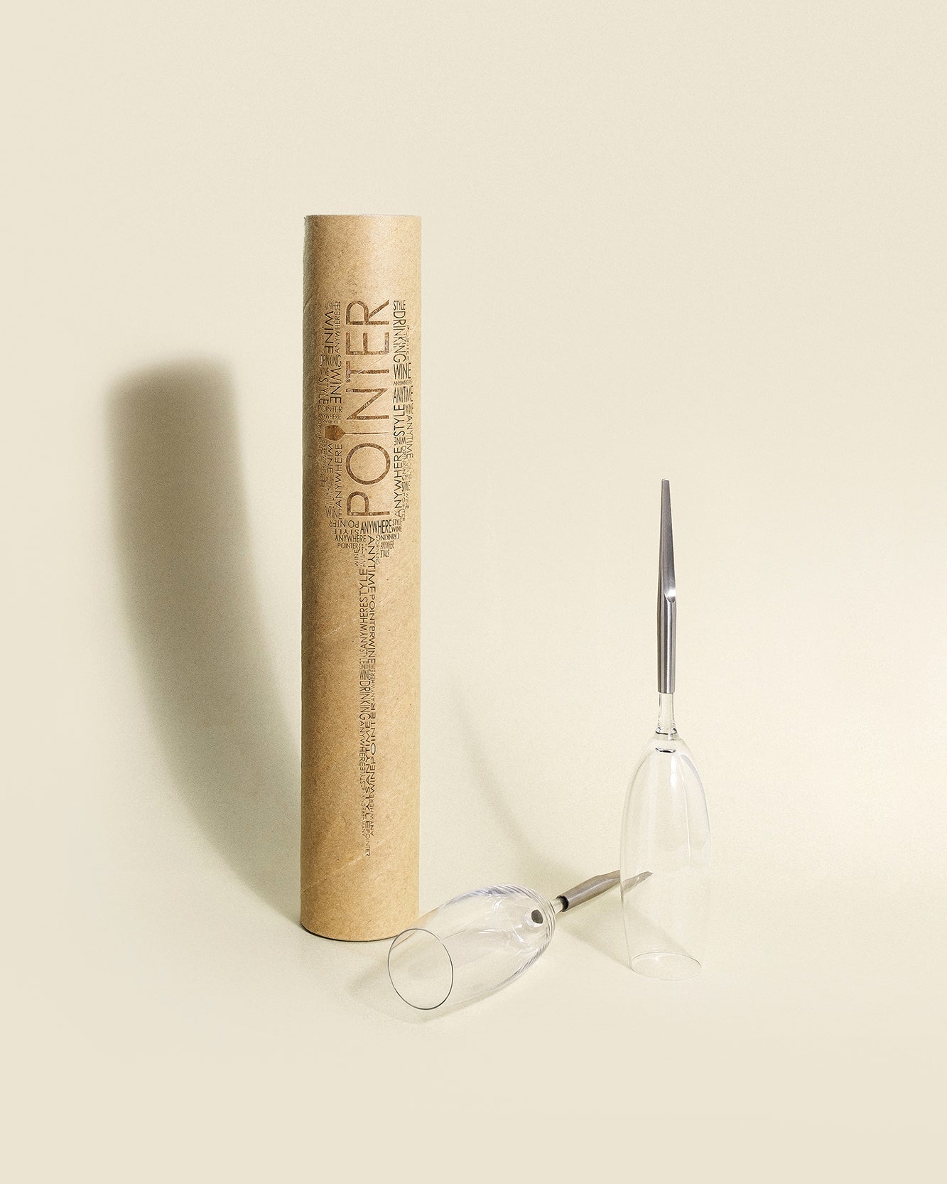 2 Pointer Crystal Champagne Glasses with metal Pin, one standing one laying next to cardboard packaging